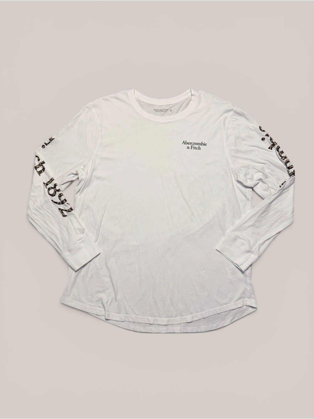 Abercrombie & Fitch white long sleeve shirt with leopard print logo on sleeves